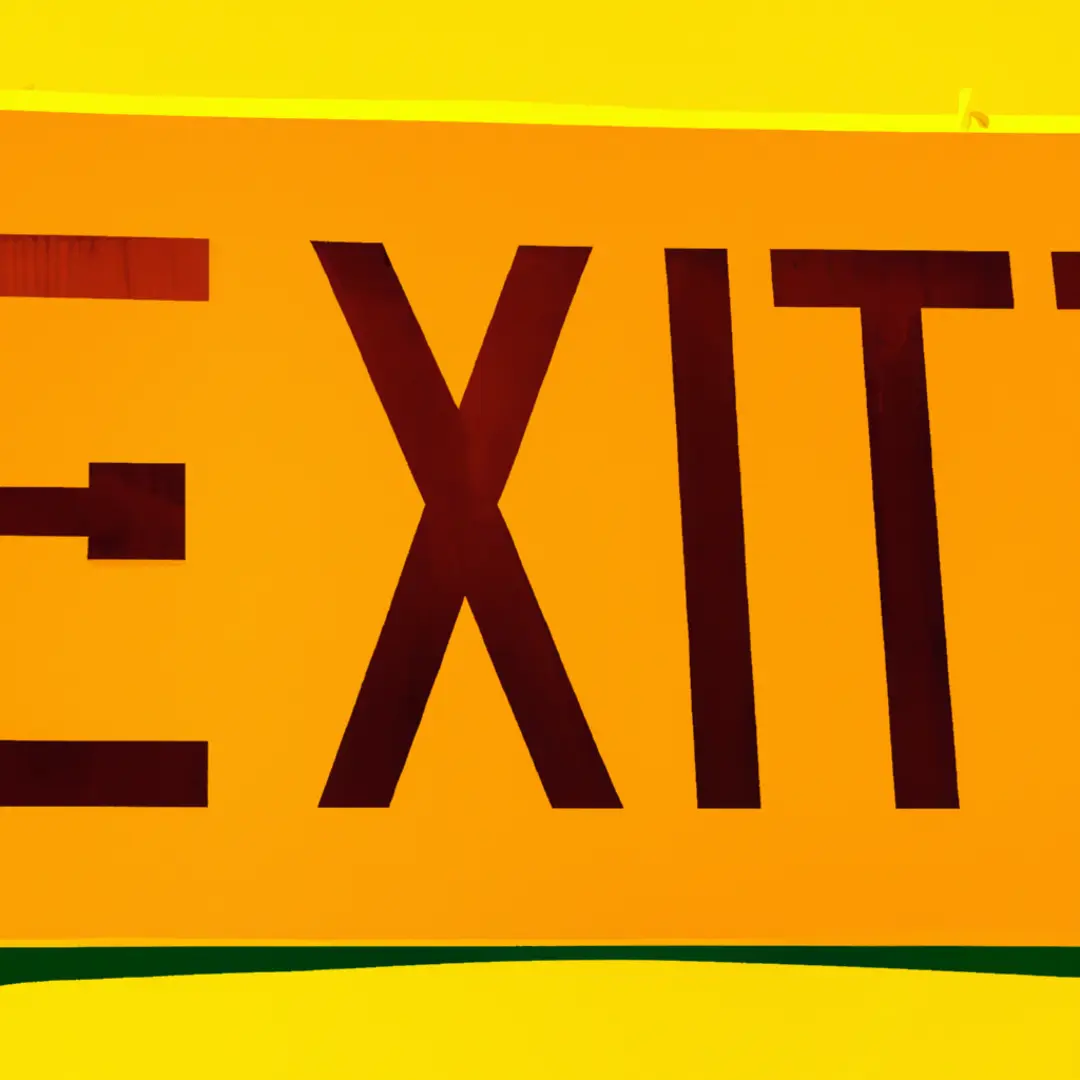 Exit sign pointing left, symbolizing the need to end a business partnership due to conflicts or changes.