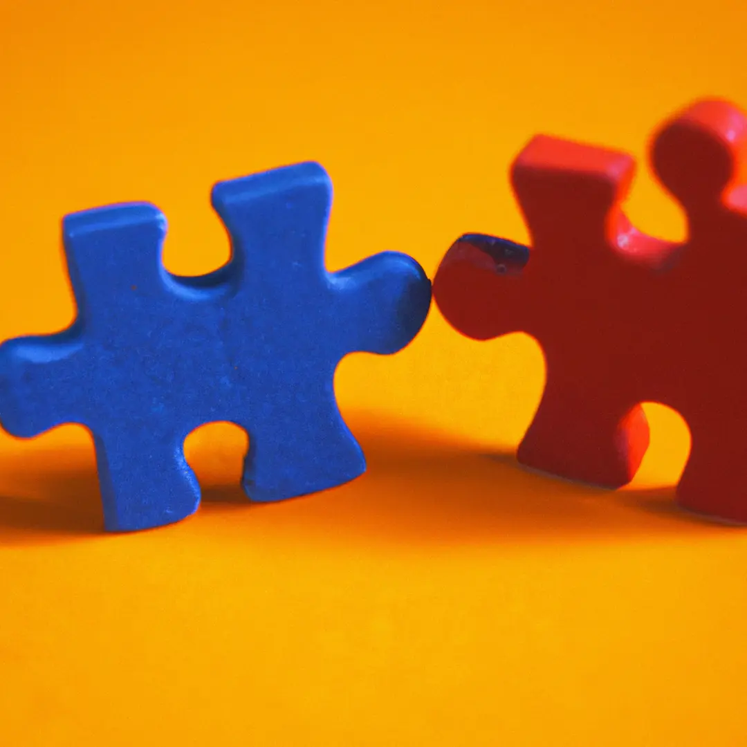 Two puzzle pieces fitting together, representing business partnerships and accessing new customer bases.