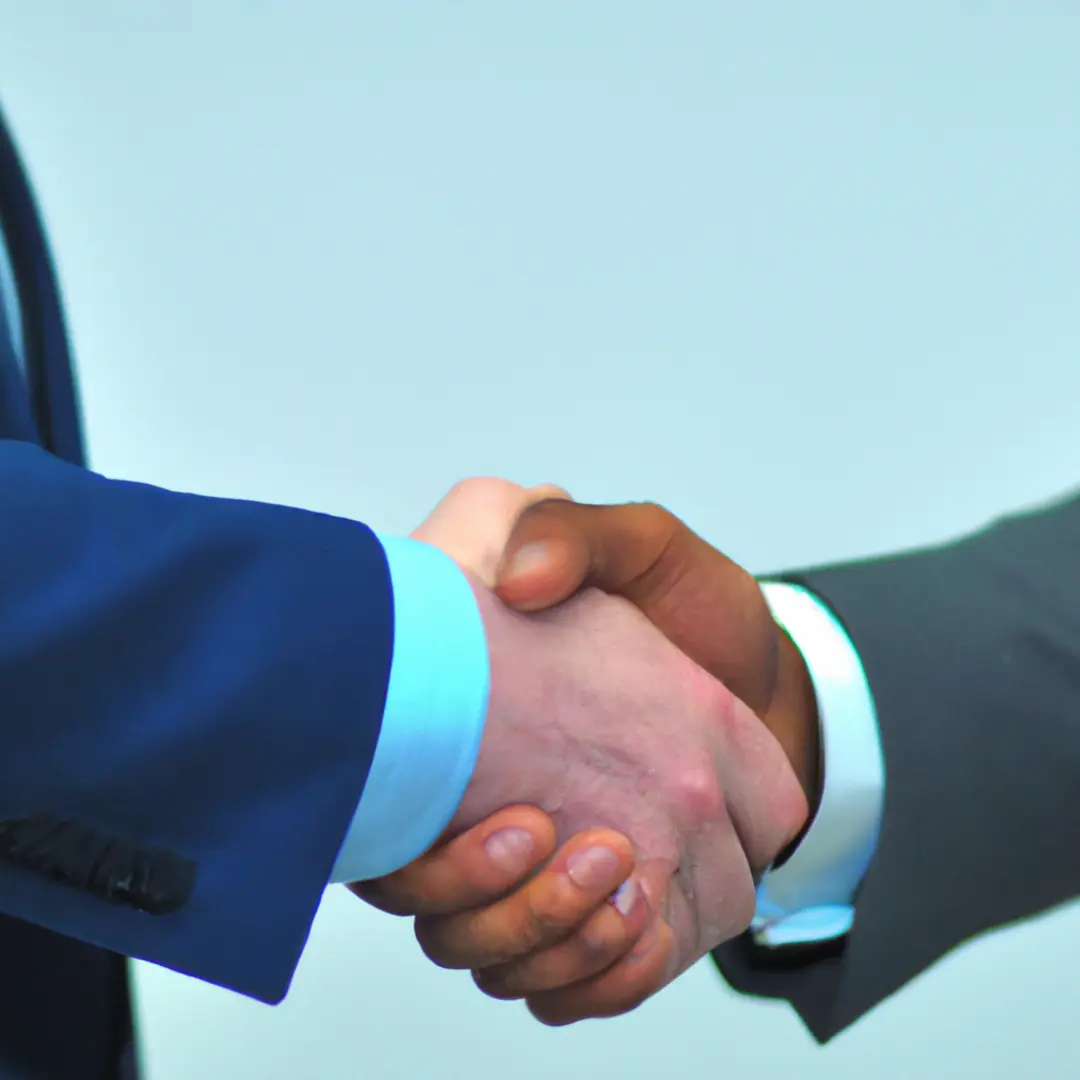 Two businessmen shaking hands, symbolizing conflict resolution and successful business partnerships.