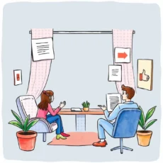 Two individuals having a discussion in a professional onboarding setting.